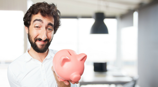 young funny man with piggy bank